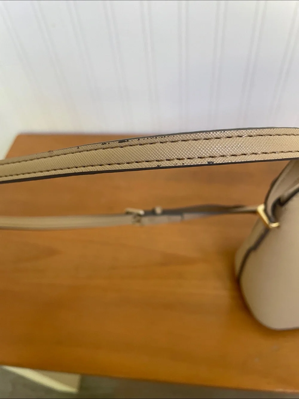 Kate Spade tan crossbody with floral, butterfly and fruit accents